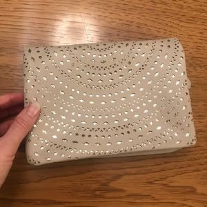 Francesca’s perforated crossbody purse/clutch
